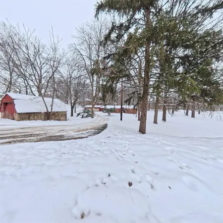 a view of snow on the side of road