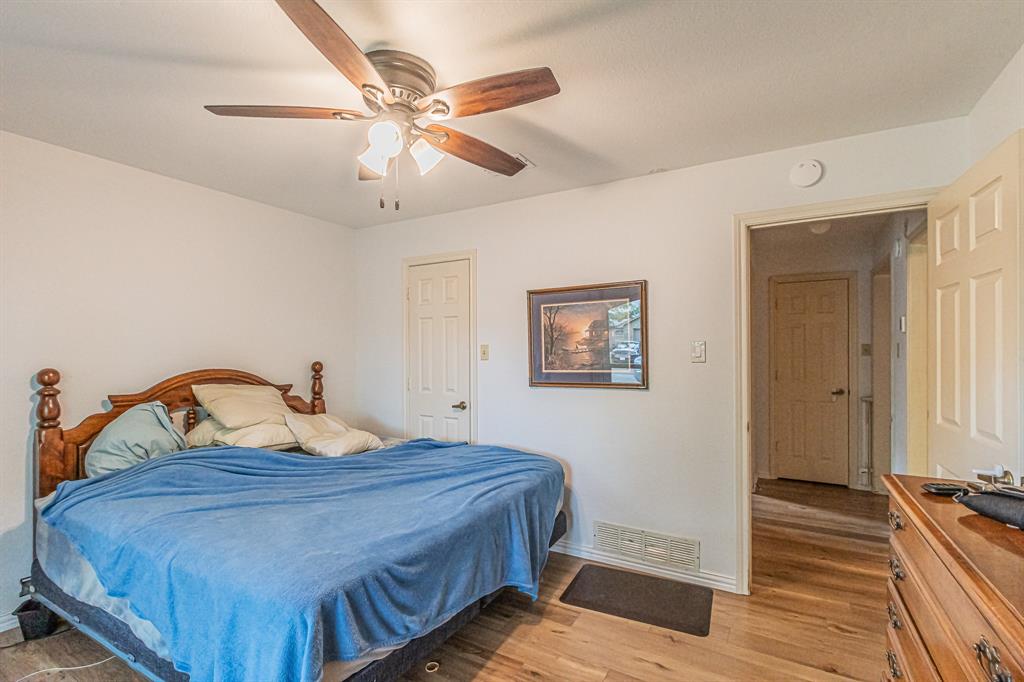 3309 Timber View Circle Bedford, TX 76021 - Photo 19 of 38 a bedroom with a bed and a dresser