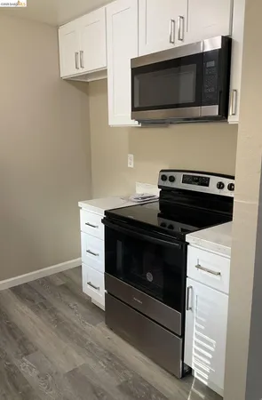 a kitchen with a stove and a microwave