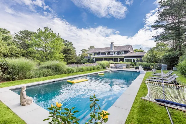 a view of a swimming pool with a patio