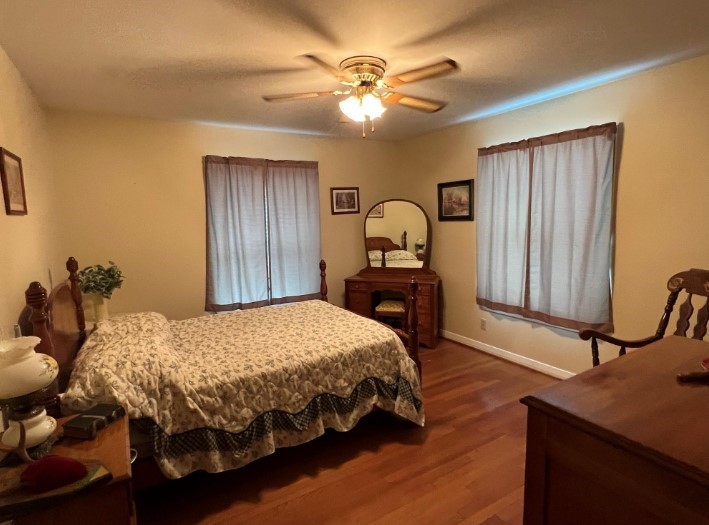 566 Schmidt Road Sealy, TX 77474 - Photo 11 of 20 a bedroom with a bed dresser and a table