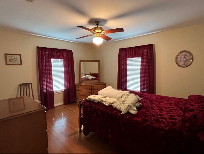 566 Schmidt Road Sealy, TX 77474 - Photo 13 of 20 a bedroom with a bed dresser and a window