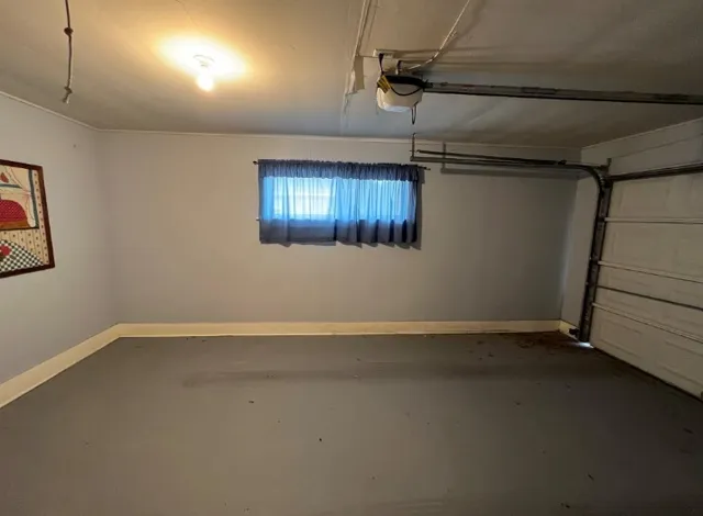 a kitchen with a sink cabinets and window