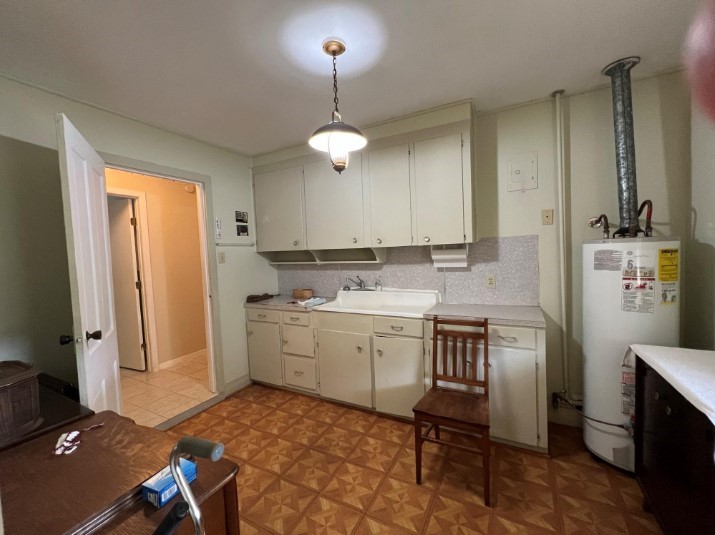 566 Schmidt Road Sealy, TX 77474 - Photo 16 of 20 a kitchen with a sink cabinets and window