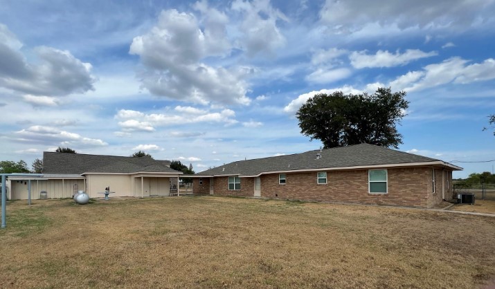 566 Schmidt Road Sealy, TX 77474 - Photo 6 of 20 a view of a house with a backyard