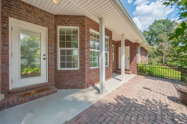 a spacious bathroom with 2 sink and a mirror