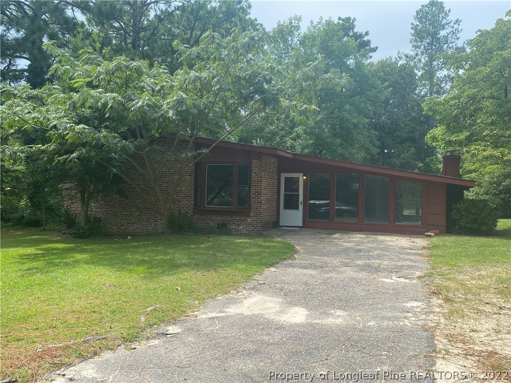 7608 Decatur Drive Fayetteville, NC 28303 - Photo 1 of 36 a view of a house with a yard and large tree