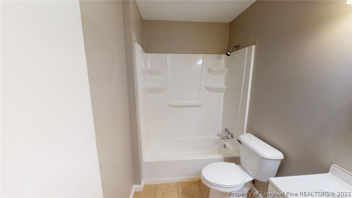 7608 Decatur Drive Fayetteville, NC 28303 - Photo 22 of 36 a white toilet and shower