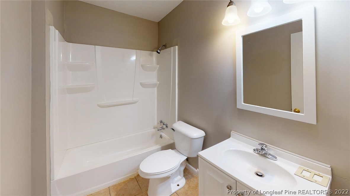 7608 Decatur Drive Fayetteville, NC 28303 - Photo 23 of 36 a bathroom with a sink toilet and shower