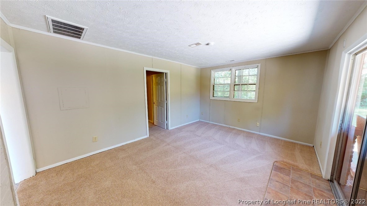 7608 Decatur Drive Fayetteville, NC 28303 - Photo 25 of 36 an empty room with windows