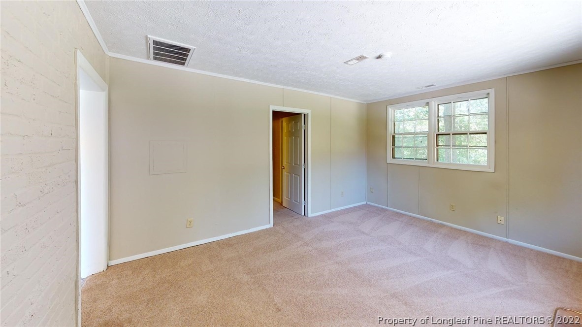 7608 Decatur Drive Fayetteville, NC 28303 - Photo 26 of 36 an empty room with windows and closet