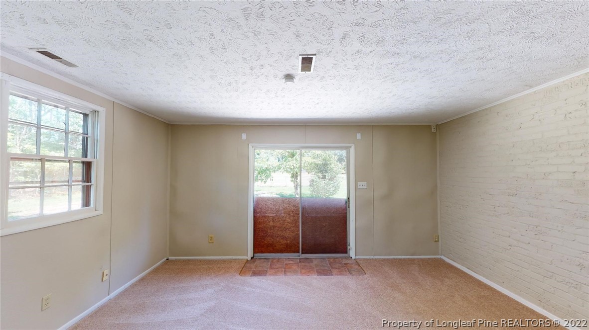 7608 Decatur Drive Fayetteville, NC 28303 - Photo 27 of 36 an empty room with windows