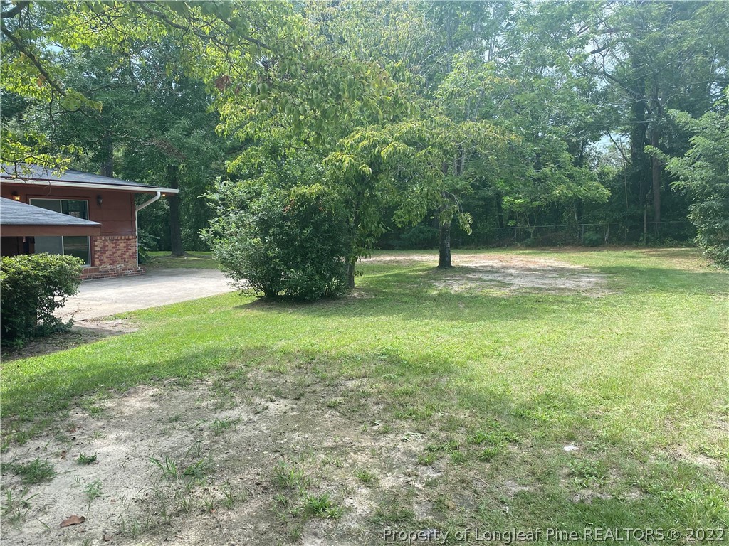 7608 Decatur Drive Fayetteville, NC 28303 - Photo 35 of 36 a backyard of a house with lots of green space