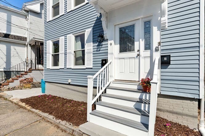 a view of a house with entryway and stairs