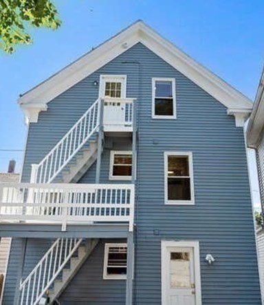 9 Foster Street, Unit 1 Gloucester, MA 01930 - Photo 12 of 13 a view of a house with wooden deck