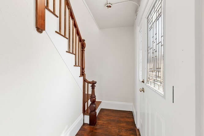 9 Foster Street, Unit 1 Gloucester, MA 01930 - Photo 3 of 13 a view of a hallway with wooden floor and entryway