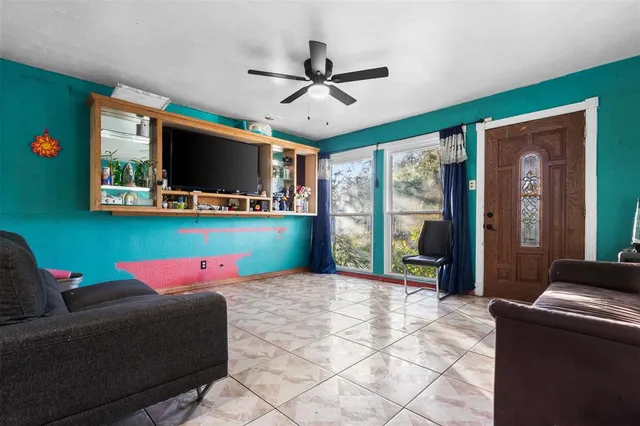 a bed room with a bed and a television