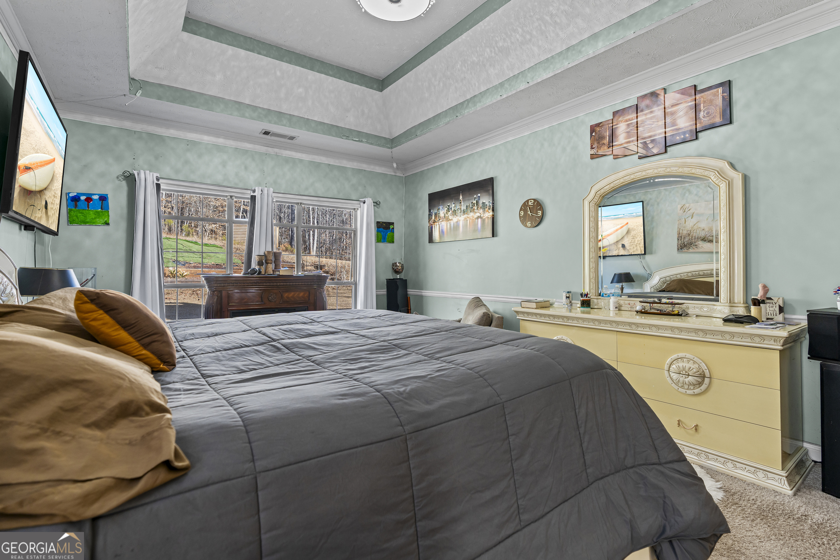2498 Highway 212 Covington, GA 30016 - Photo 24 of 74 a bedroom with a bed and dresser with mirror