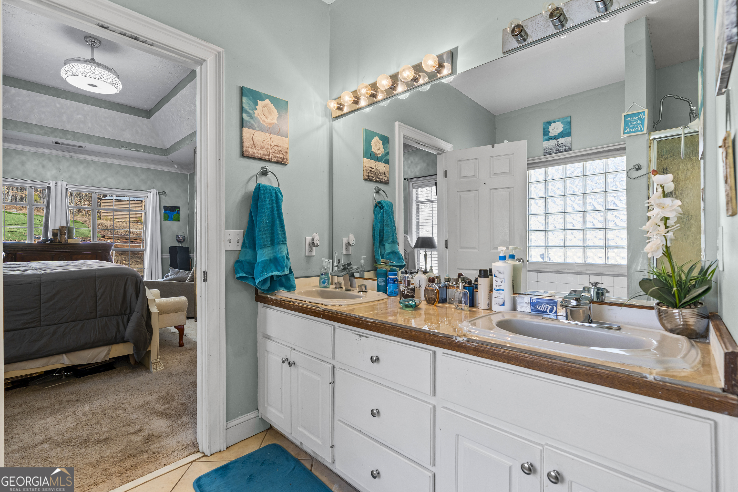 2498 Highway 212 Covington, GA 30016 - Photo 28 of 74 a spacious en suite bathroom with double sink a mirror and a shower