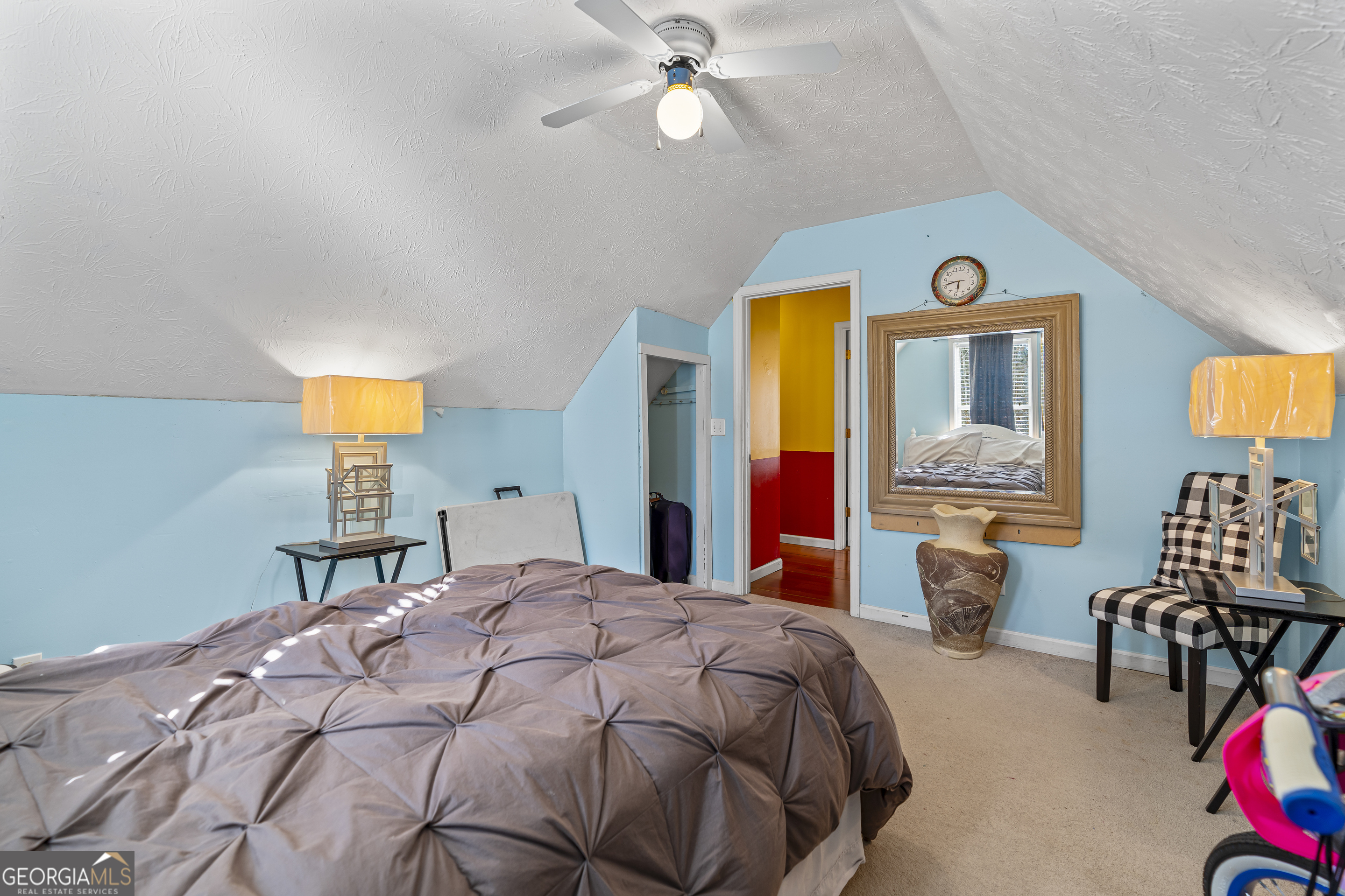 2498 Highway 212 Covington, GA 30016 - Photo 36 of 74 a bedroom with a bed and a chandelier