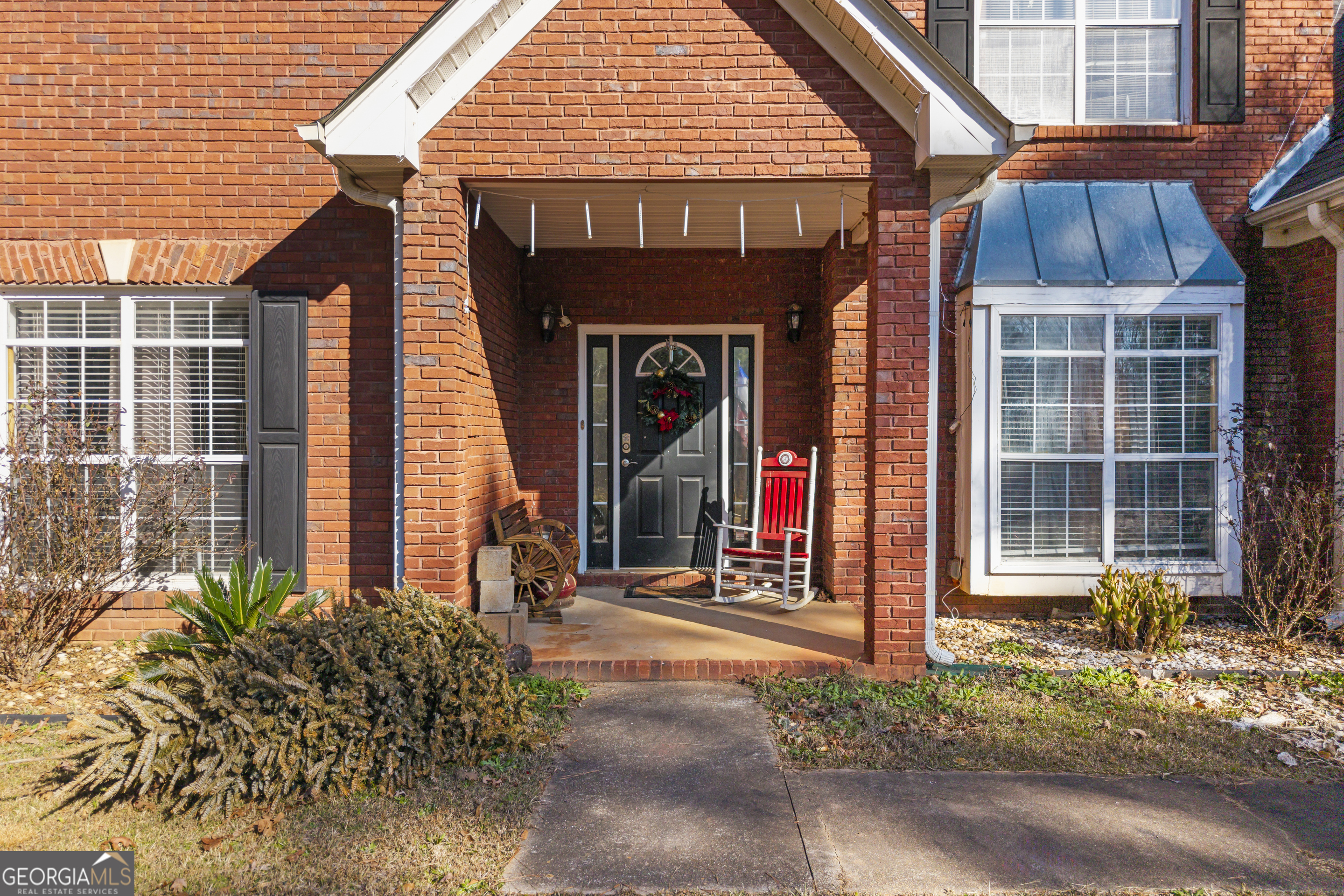 2498 Highway 212 Covington, GA 30016 - Photo 4 of 74 a front view of a house with a porch