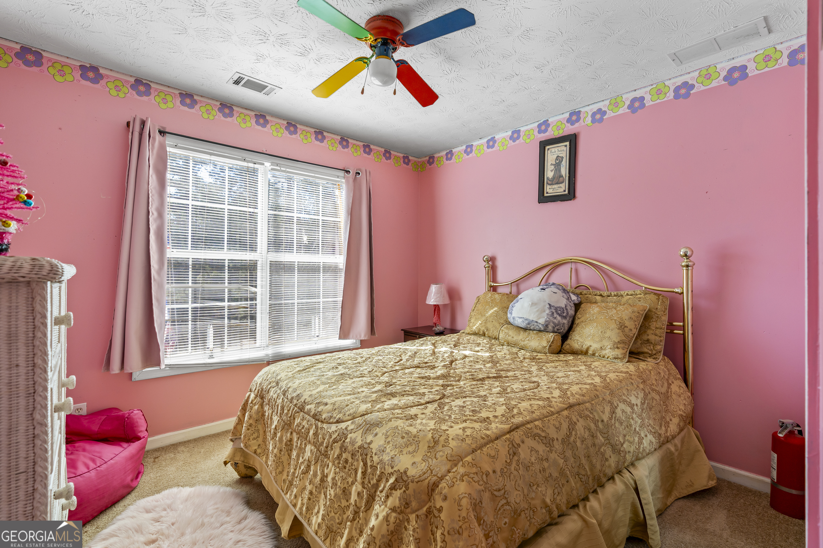 2498 Highway 212 Covington, GA 30016 - Photo 41 of 74 a bedroom with a bed and a painting on the wall