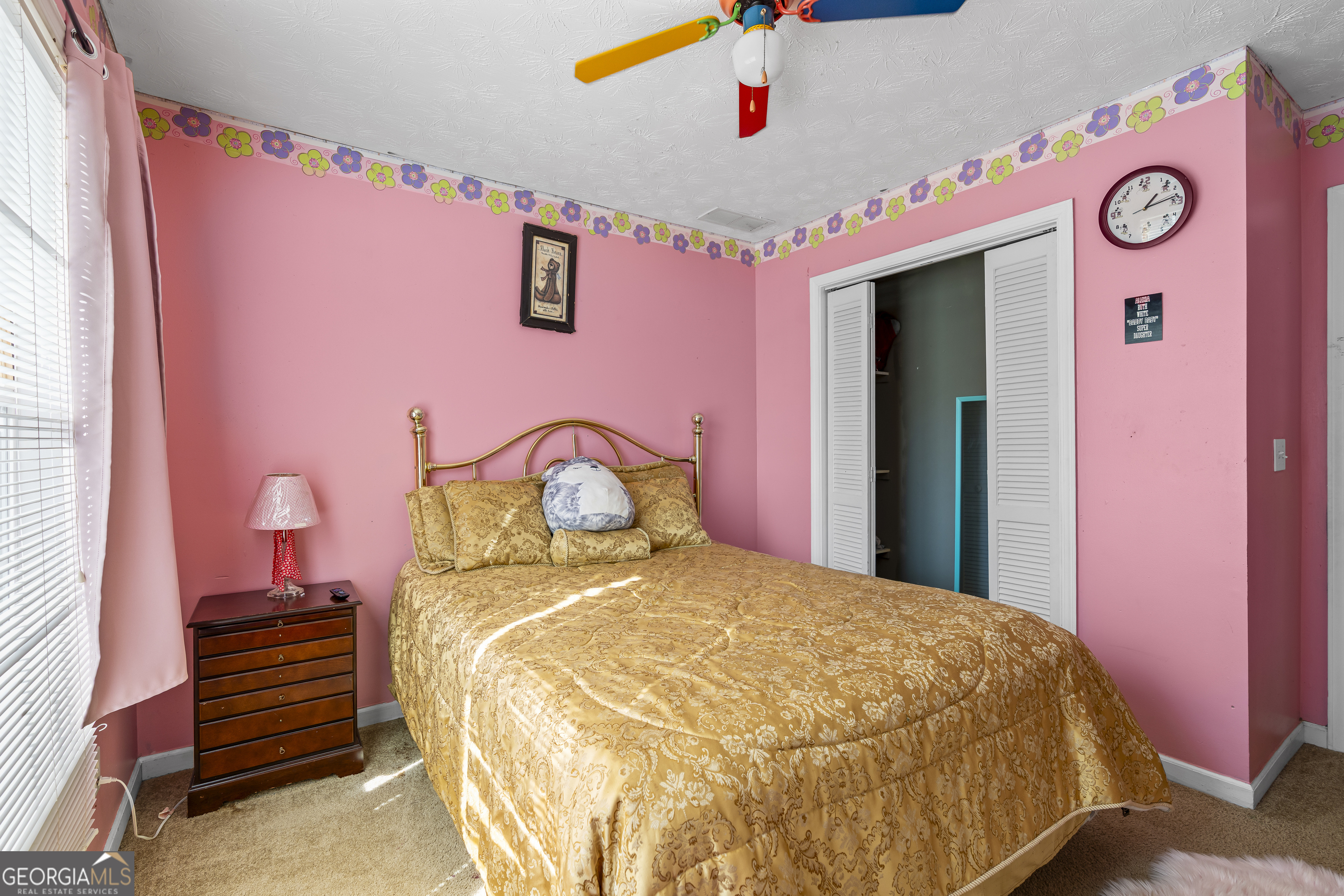 2498 Highway 212 Covington, GA 30016 - Photo 42 of 74 a bedroom with a bed and a chandelier