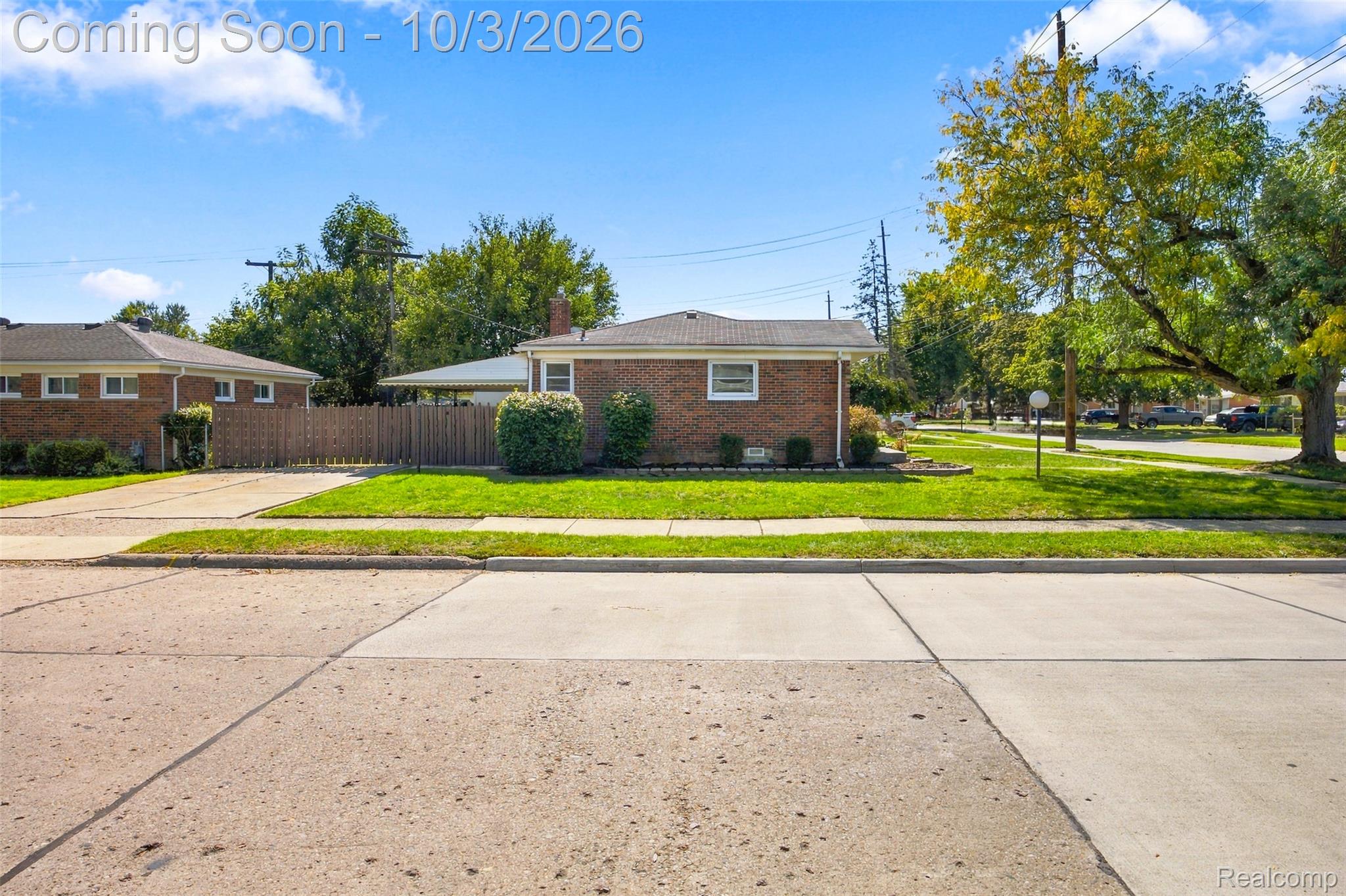 556 Henry Ruff Road Garden City, MI 48135 - Photo 40 of 49 Brick exterior with a gabled roof and mature landscaping