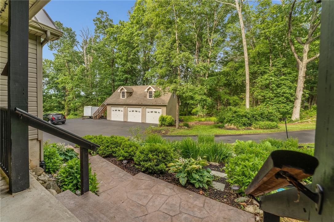 465 Raubsville Road Easton, PA 18042 - Photo 55 of 60 A detached three-car garage complements the wooded landscape and paved driveway.