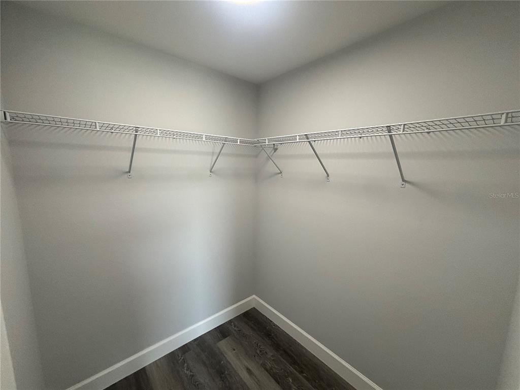 13187 Southwest 103rd Place Dunnellon, FL 34432 - Photo 16 of 24 a view of a room with racks on the wall