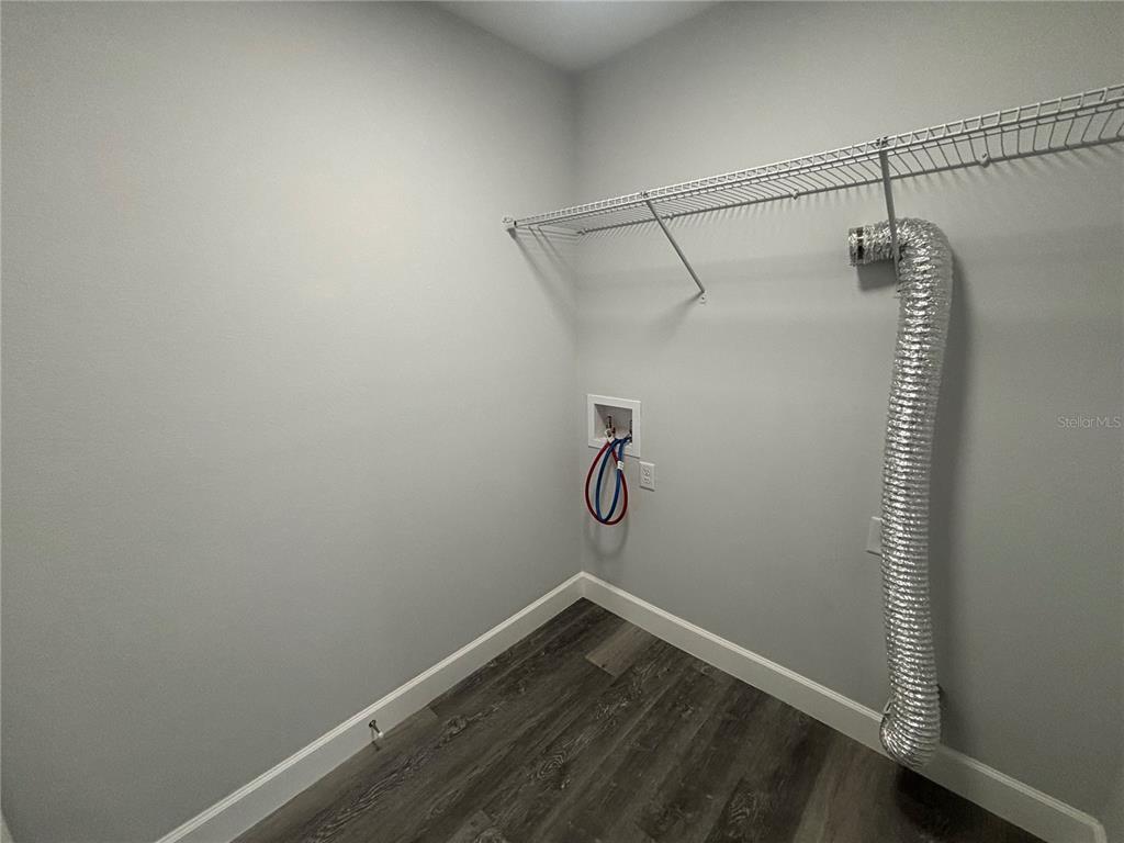 13187 Southwest 103rd Place Dunnellon, FL 34432 - Photo 18 of 24 a view of a room with racks on the wall