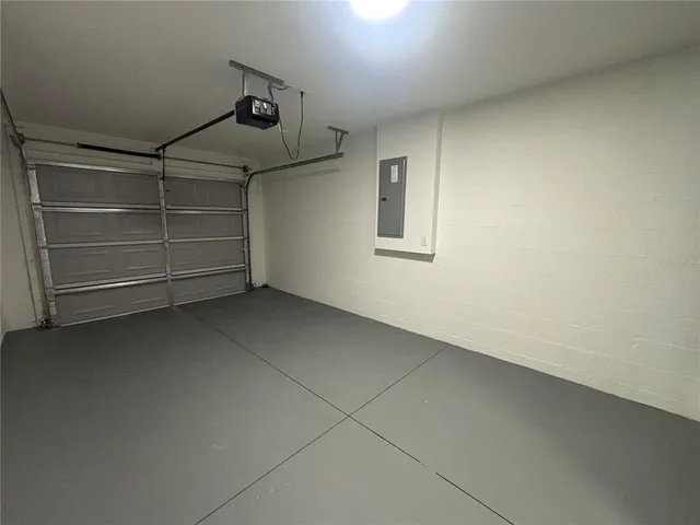 a view of an empty room and a window