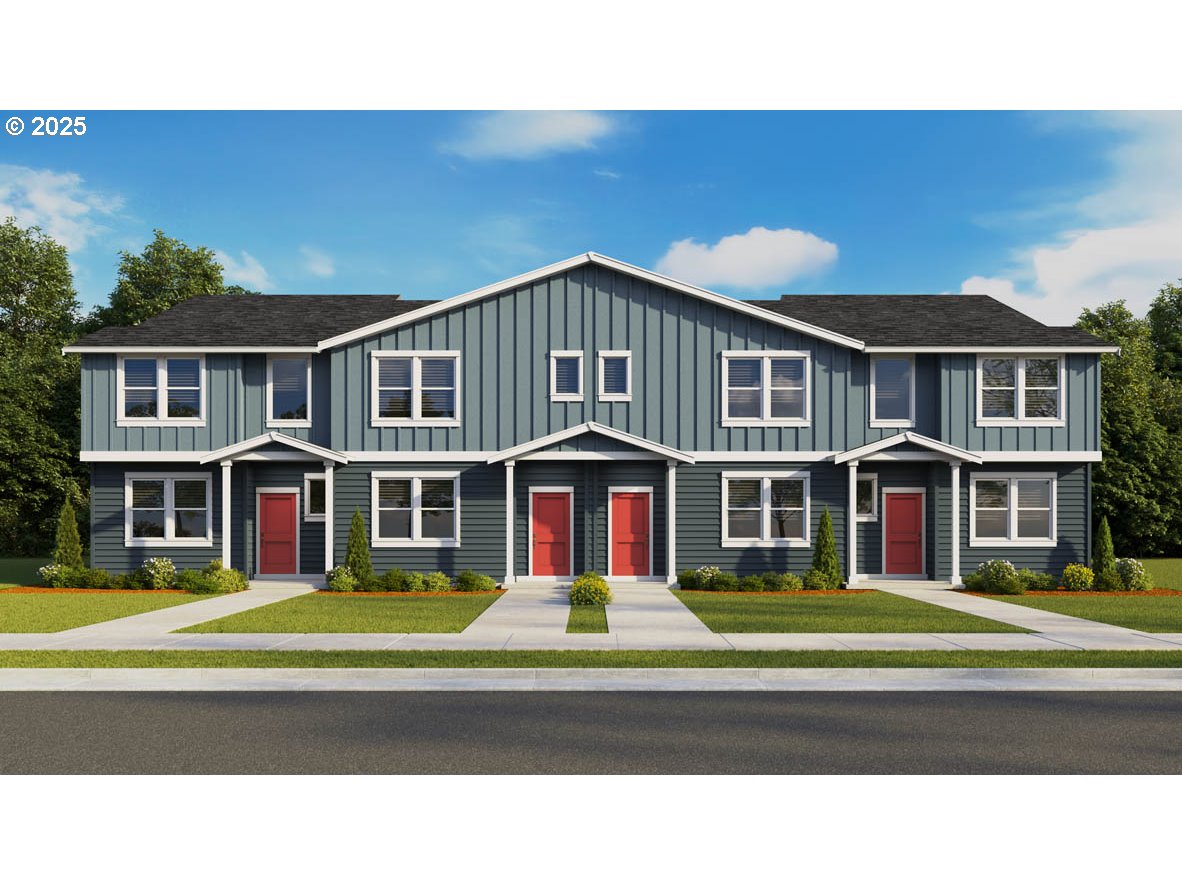 a front view of building with door and trees