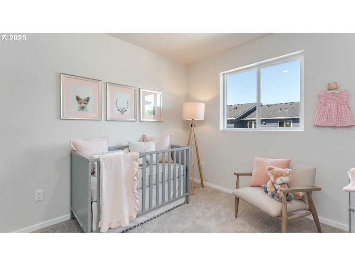 3505 Southwest Thomas Avenue Gresham, OR 97080 - Photo 20 of 26 a living room with furniture and a baby crib
