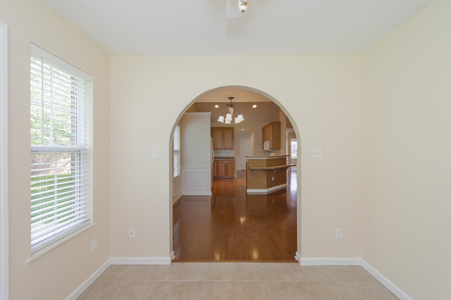 6139 Kristins Gate Way Powell, TN 37849 - Photo 14 of 30 Arched Transition from Sunroom