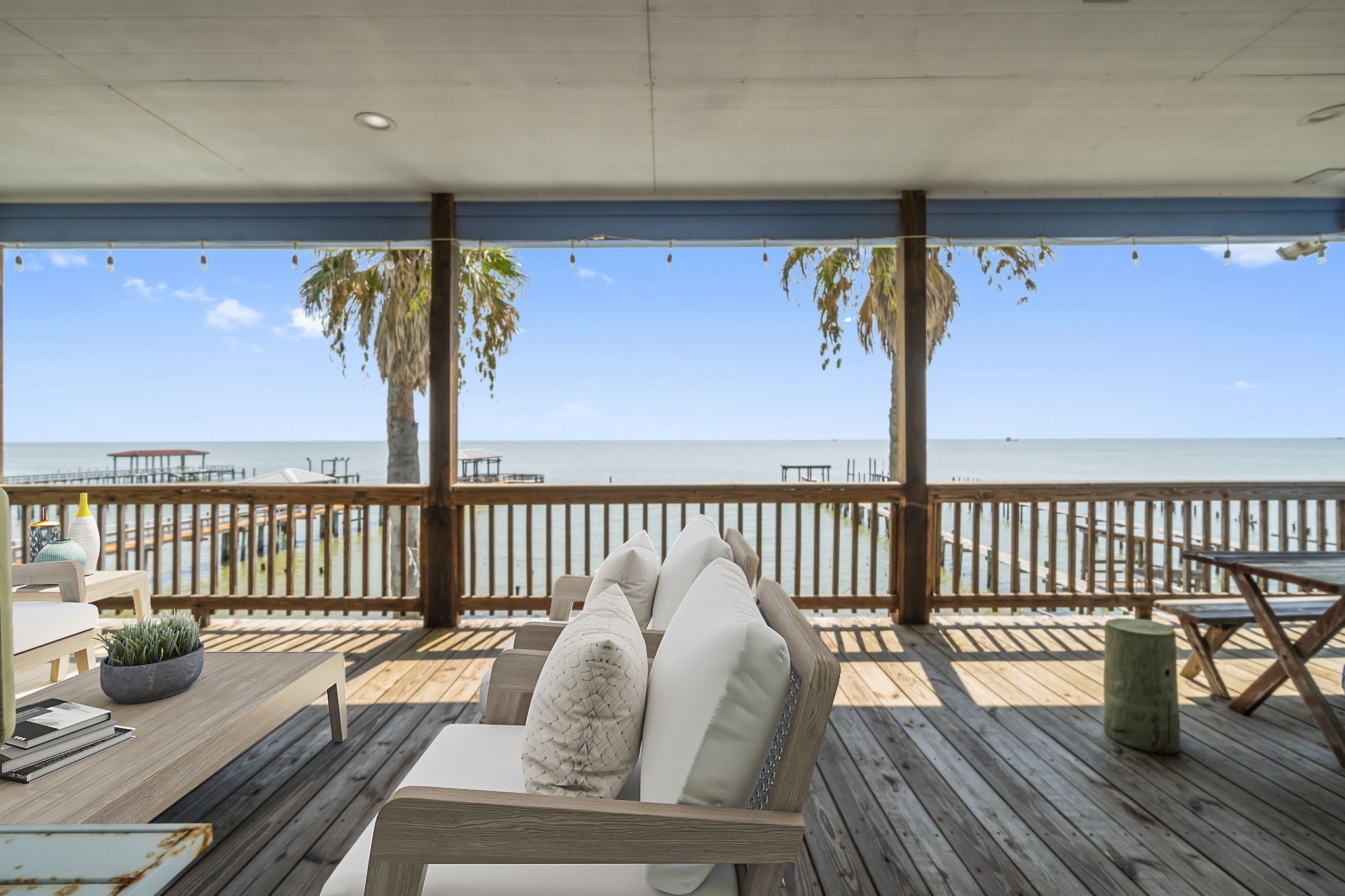 a view of balcony with furniture and wooden floor