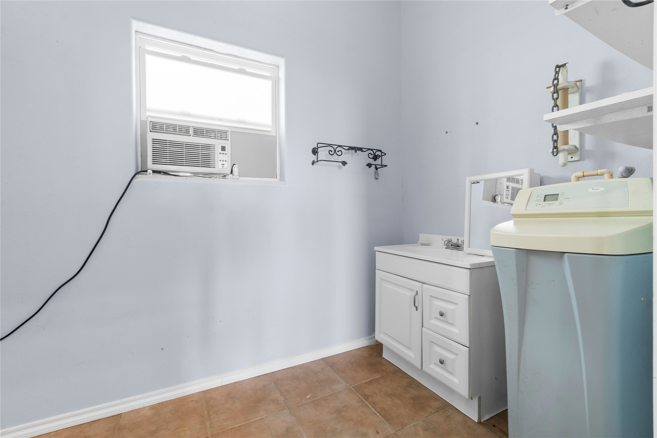 427 2nd Street San Leon, TX 77539 - Photo 25 of 30 a bathroom with a sink toilet and vanity