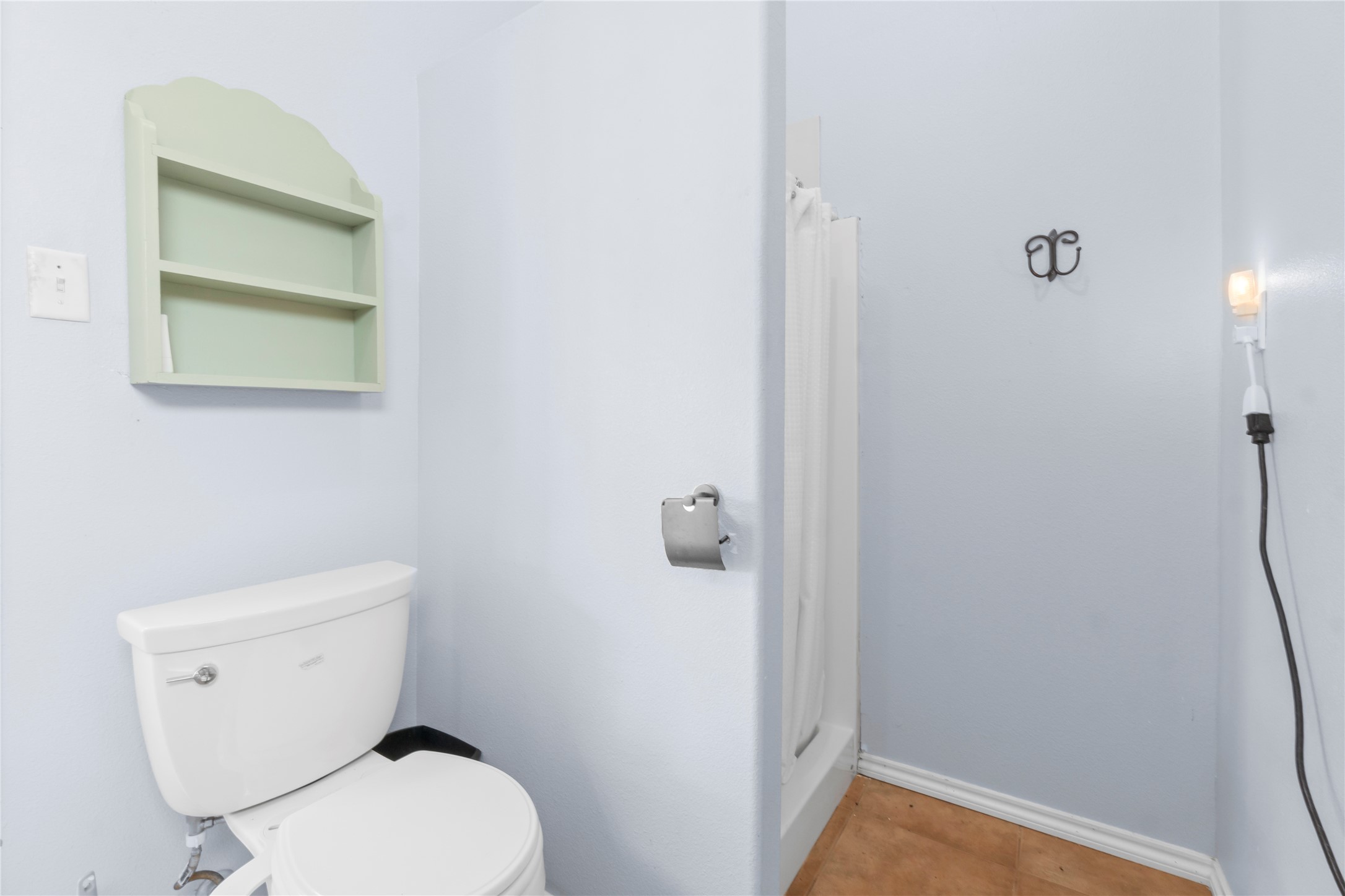 427 2nd Street San Leon, TX 77539 - Photo 26 of 30 a white toilet sitting next to a shower