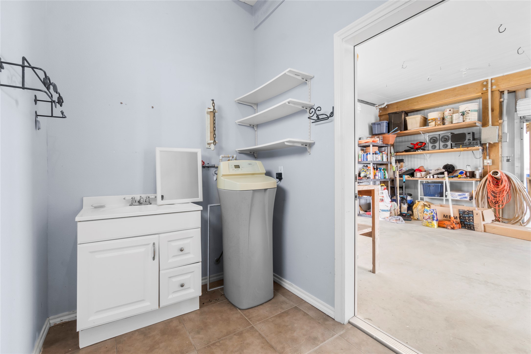 427 2nd Street San Leon, TX 77539 - Photo 27 of 30 a view of storage and utility room with washer and dryer