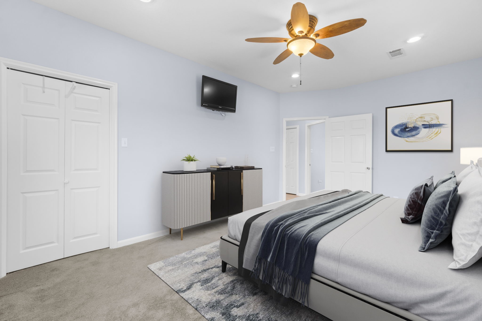 427 2nd Street San Leon, TX 77539 - Photo 7 of 30 a bedroom with a bed and a ceiling fan