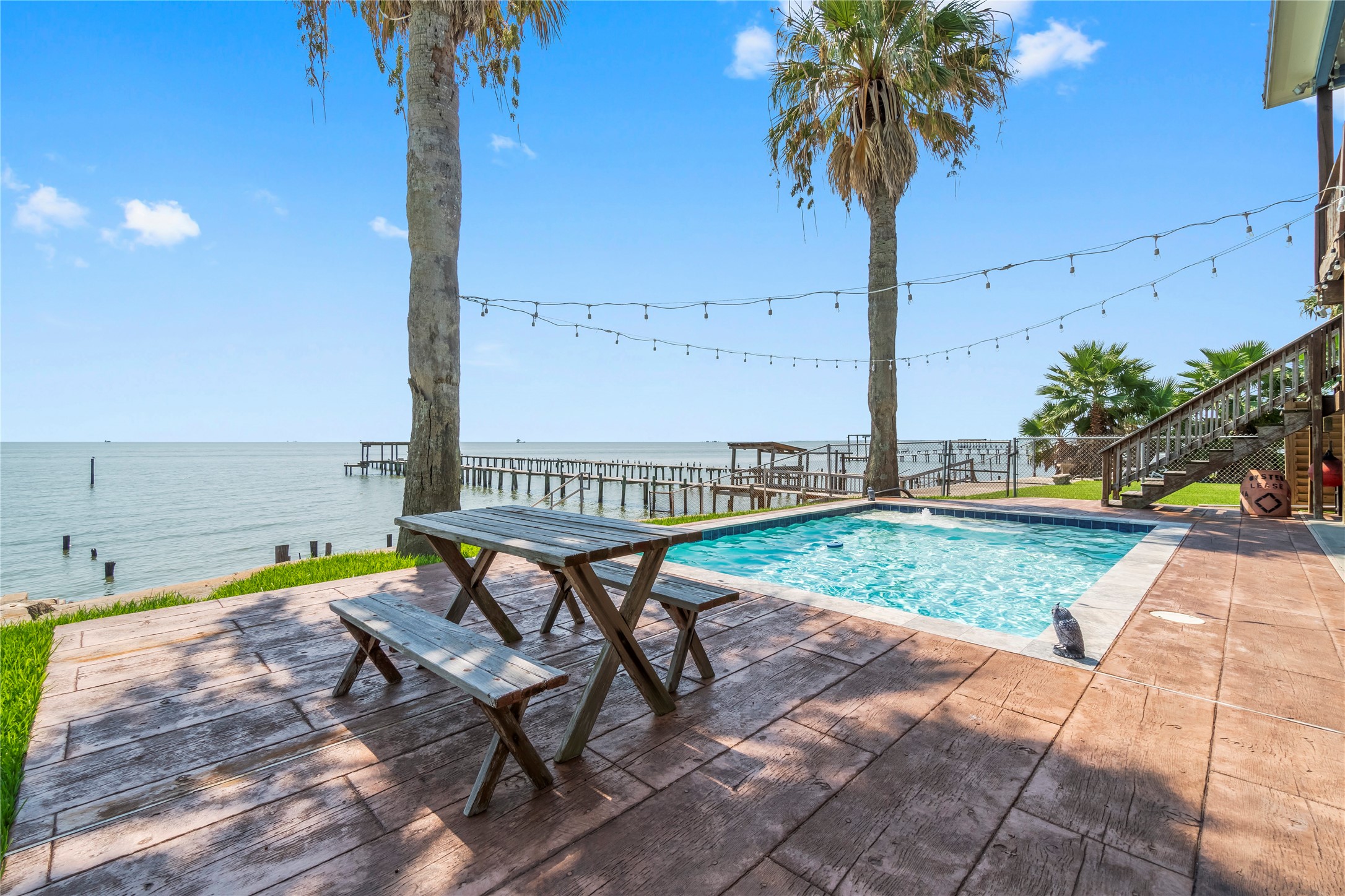 427 2nd Street San Leon, TX 77539 - Photo 8 of 30 a view of swimming pool with a table and chair
