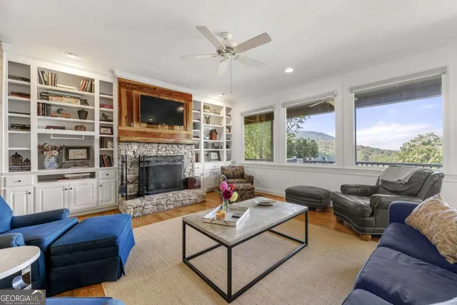a kitchen with a table chairs refrigerator and microwave