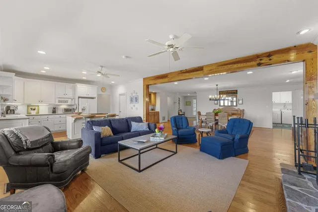 a kitchen with cabinets appliances a sink and a window