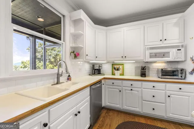 a view of a two chairs in the balcony