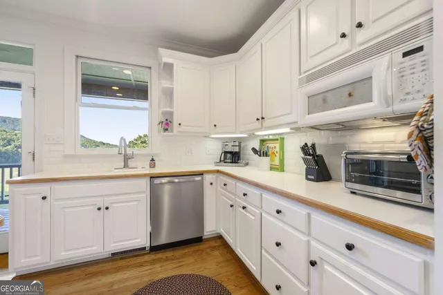 a view of a two chairs in the balcony