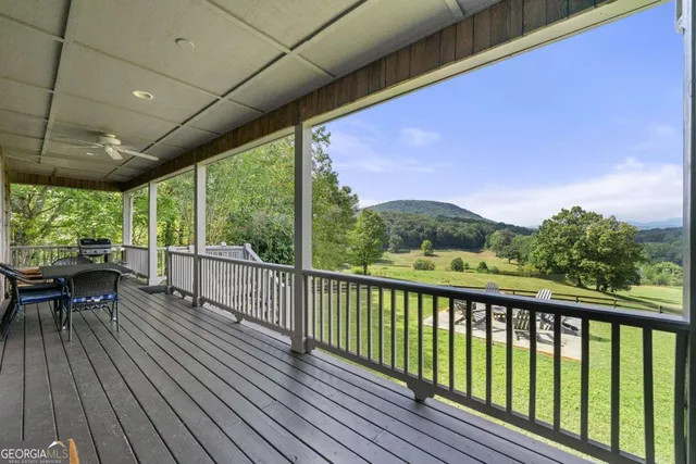 a view of a kitchen with white cabinets