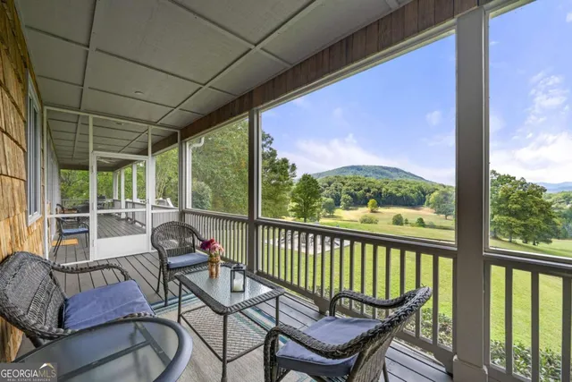 a bathroom with a granite countertop sink window and a mirror
