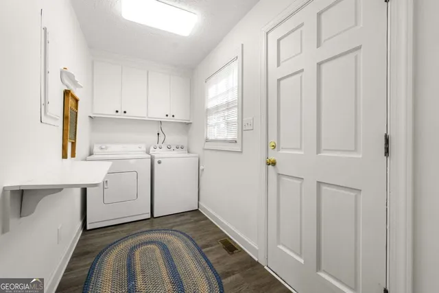 a spacious bathroom with a double vanity sink a mirror and a shower