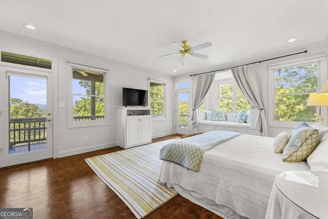 a bed room with a bed and a chair