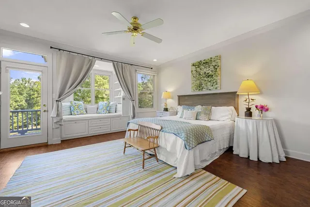 a bedroom with a large bed and a window